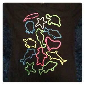 Black juniors small tee with neon animal outlines.